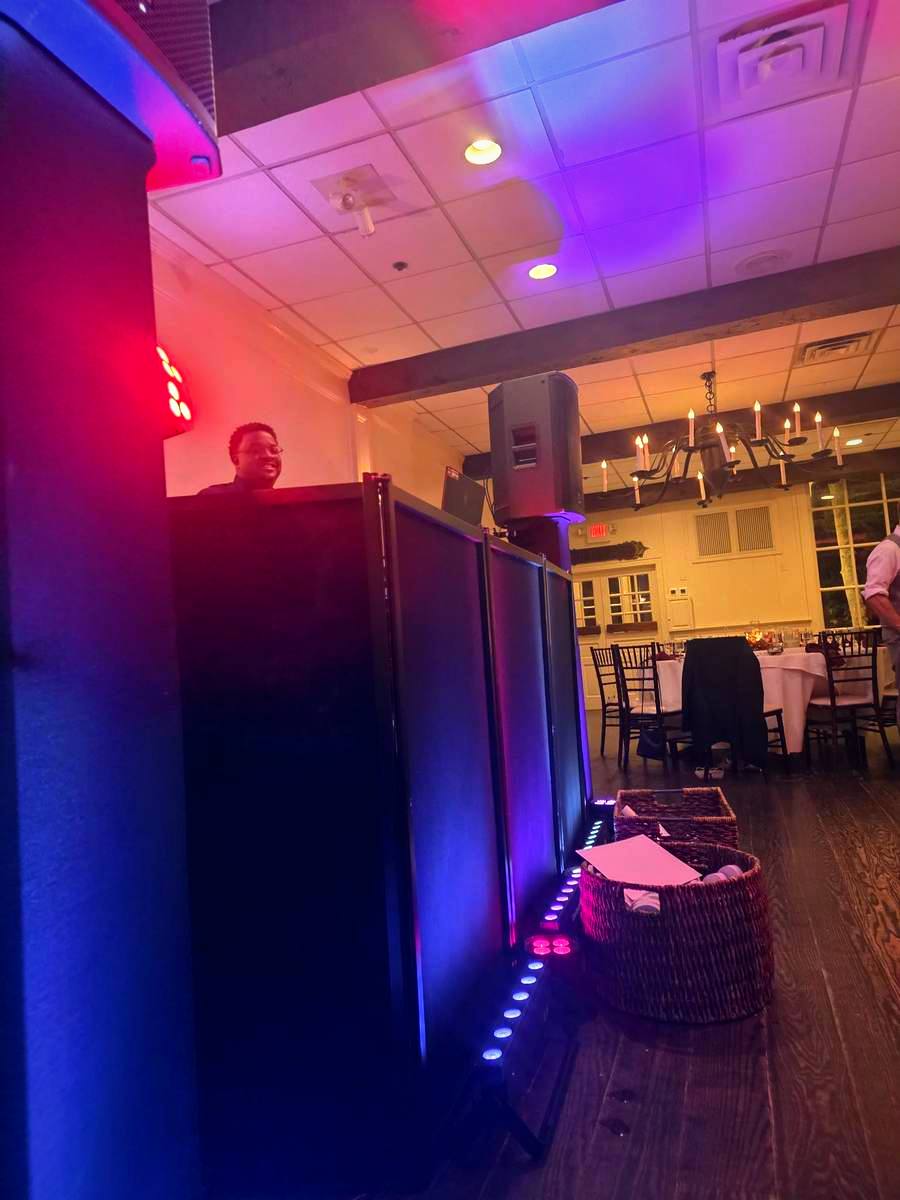 The black DJ setup at a wedding reception